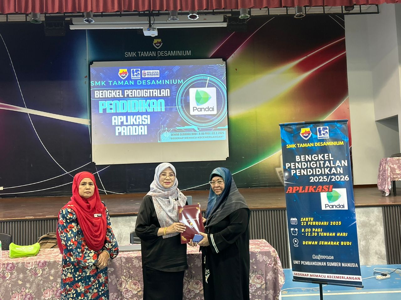 Receiving a certificate of appreciation as facilitator, SMK Taman Desaminium